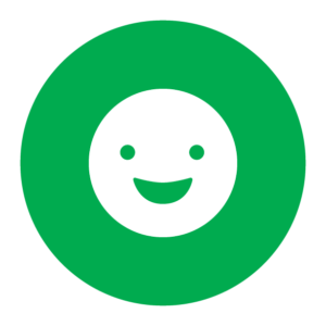 A white smiley face on a green background