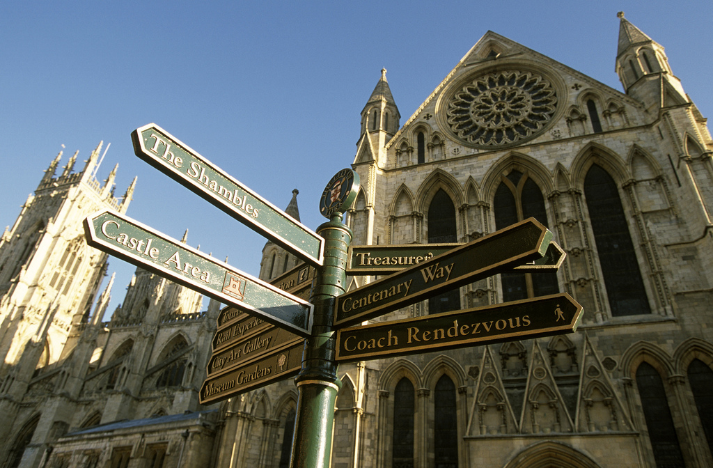 A photo of a signpost outside York Minster, showing the way to the Minster, the Shambles and other key landmarks.