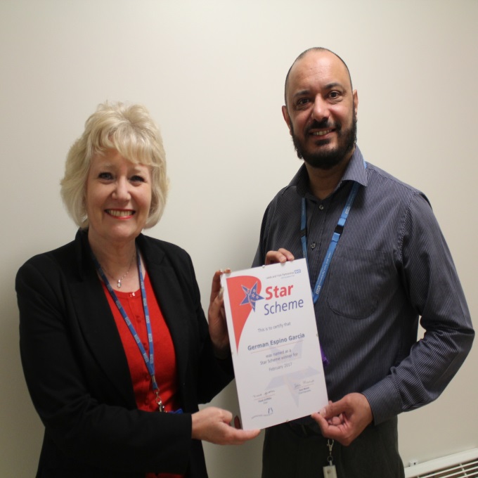 Susan Tyler with German Espino Garcia with his award.