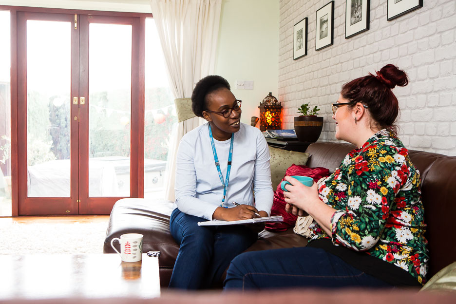 Community mental health nurse with patient at home