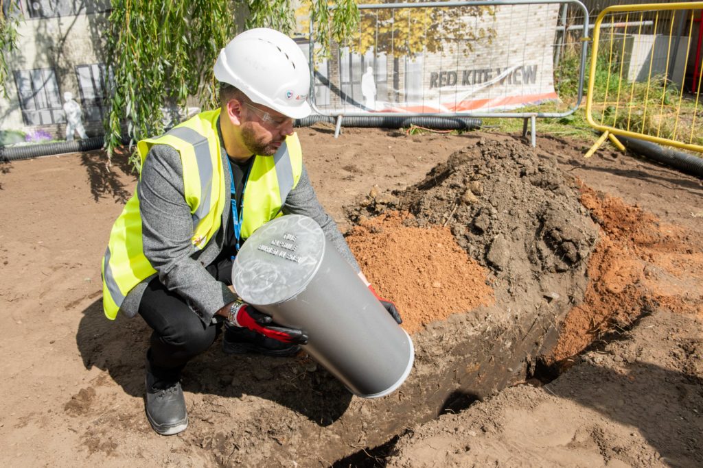 Service Manager Nik Lee burying the time capsule