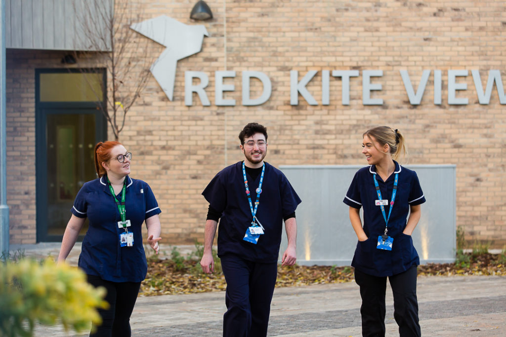 Nurses walking in front of Red Kite View