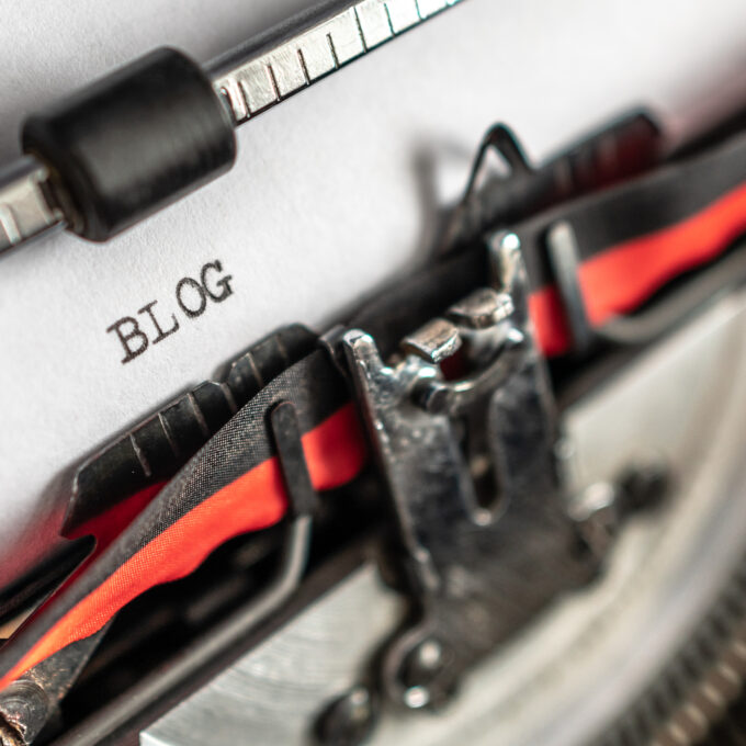 the word 'blog' written on an old style typewriter.