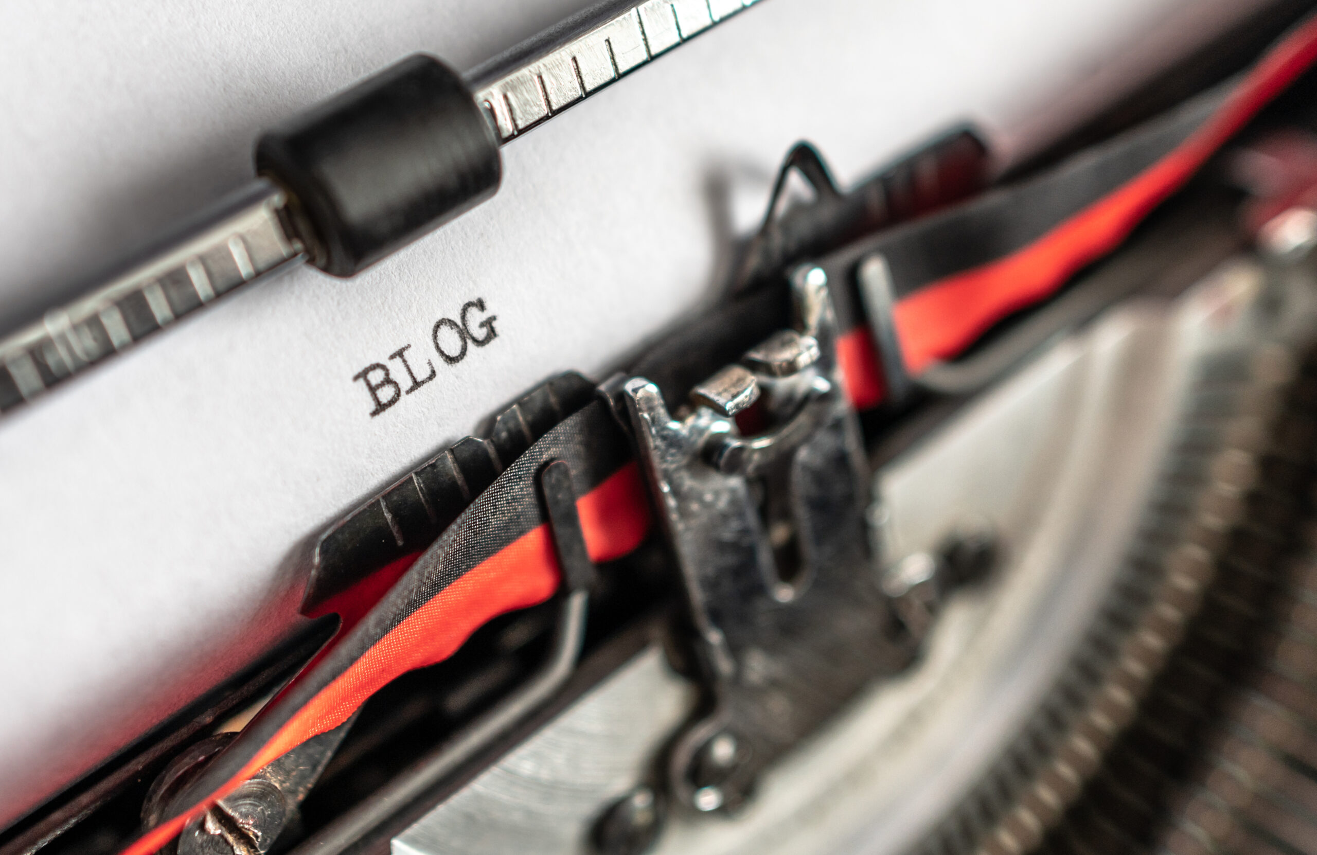 the word 'blog' written on an old style typewriter.