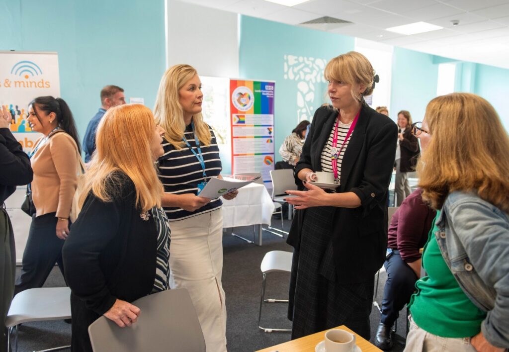 Attendees talking at our AGM in September 2026