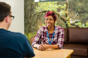 Nurse speaking to patient