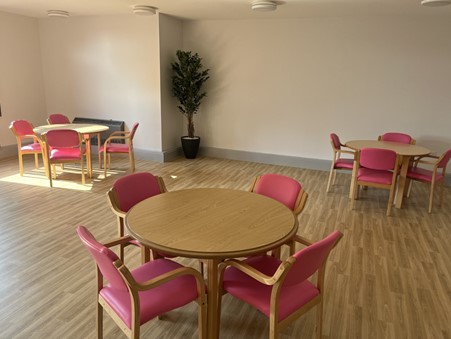 Tables and chairs in the visiting area at The Mount