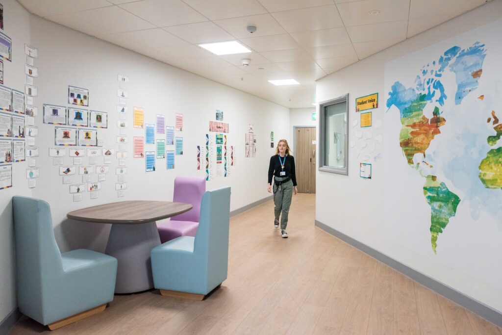 Inside Red Kite View's education room. A member of staff is walking.