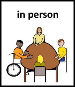 Illustration of four people sitting around a table having a meeting in person.