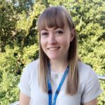 Blonde woman in white t-shirt. ,Megan Garside.