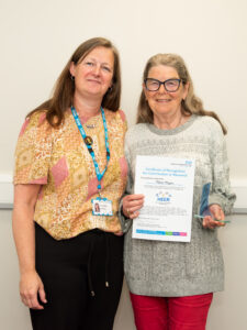 Petuyla Naylor, HEER group spotlight winner receiving their award from Sara Munro Chief Executive Officer at LYPFT